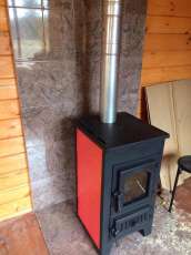 Купить стальной камин Везувий ПК-01 (270) в Борисове фото в интерьере в Борисове