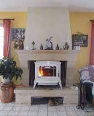 Печь-камин чугунный Invicta Bradford в интерьере Амазонка бай фото в Борисове