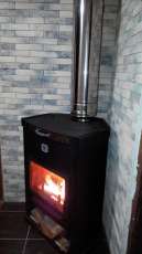 Стальной недорогой камин Теплодар ОВ-120 (угловой) фото в интерьере в Борисове