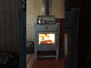 Стальной камин со стеклом Теплодар Кадриль фото в интерьере в Борисове