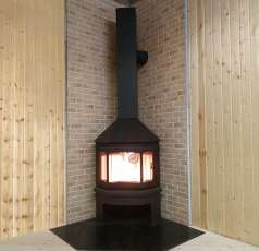 Стальной камин Бавария Мюнхен угловой чёрный (без перемычки) фото в интерьере в Борисове