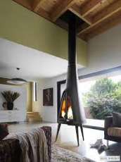 Печь-камин чугунный Invicta Pow-Wow в интерьере Амазонка бай фото в Борисове